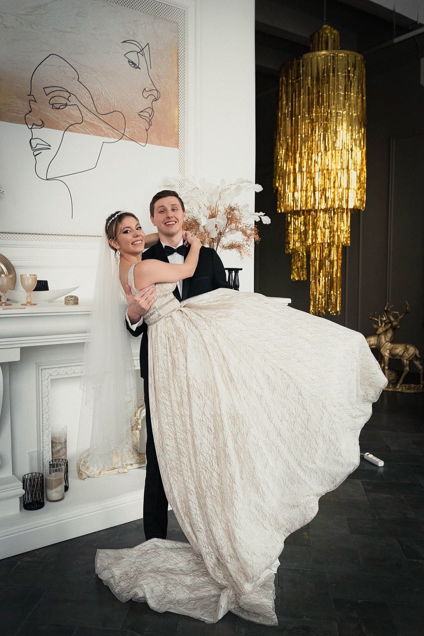 Stock photograph of a newly married couple posing in an elegant interior